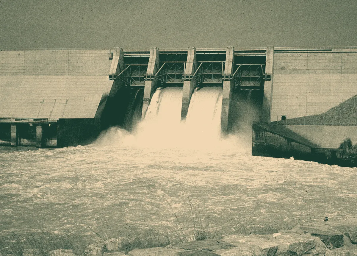 Water pouring through four open spillway gates at Kainji Dam on the River Niger.