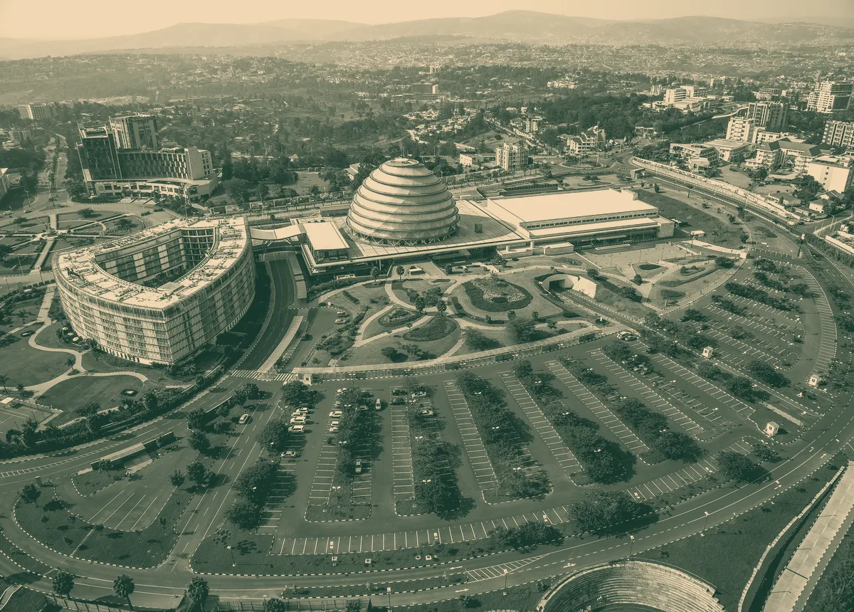 Aerial view of the domed Kigali Convention Centre and the city around it.